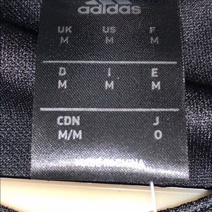 Adidas black AIG jersey shirt.